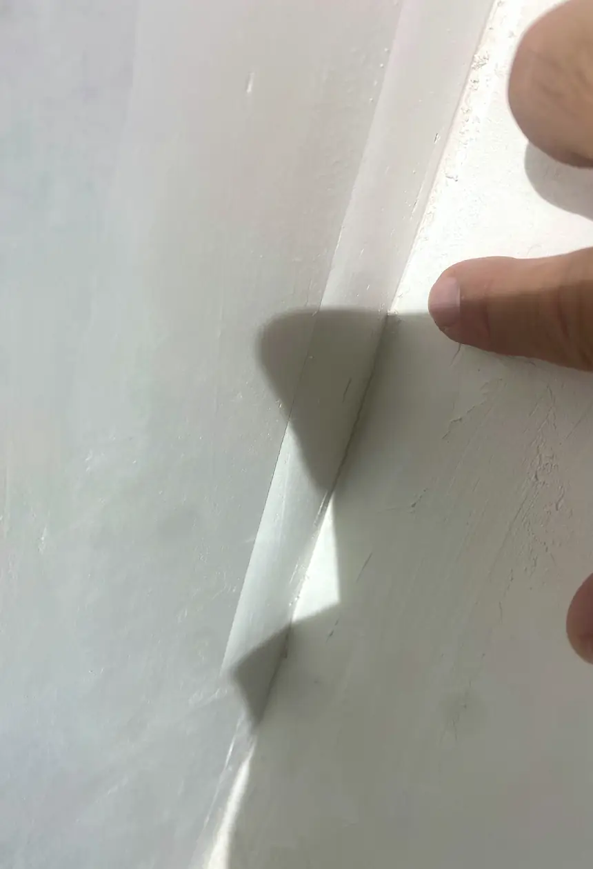 Drywall hole patched and skimmed smooth, wall surface blended with no visible seams or shadows in Aliso Viejo.