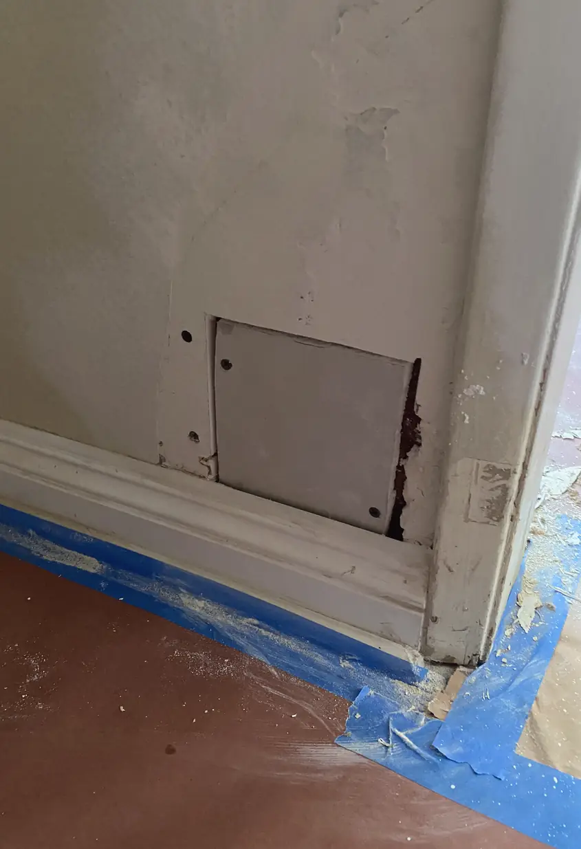 Repaired drywall hole in Anaheim patch job showing a smooth, even surface with no visible seams or shadows.