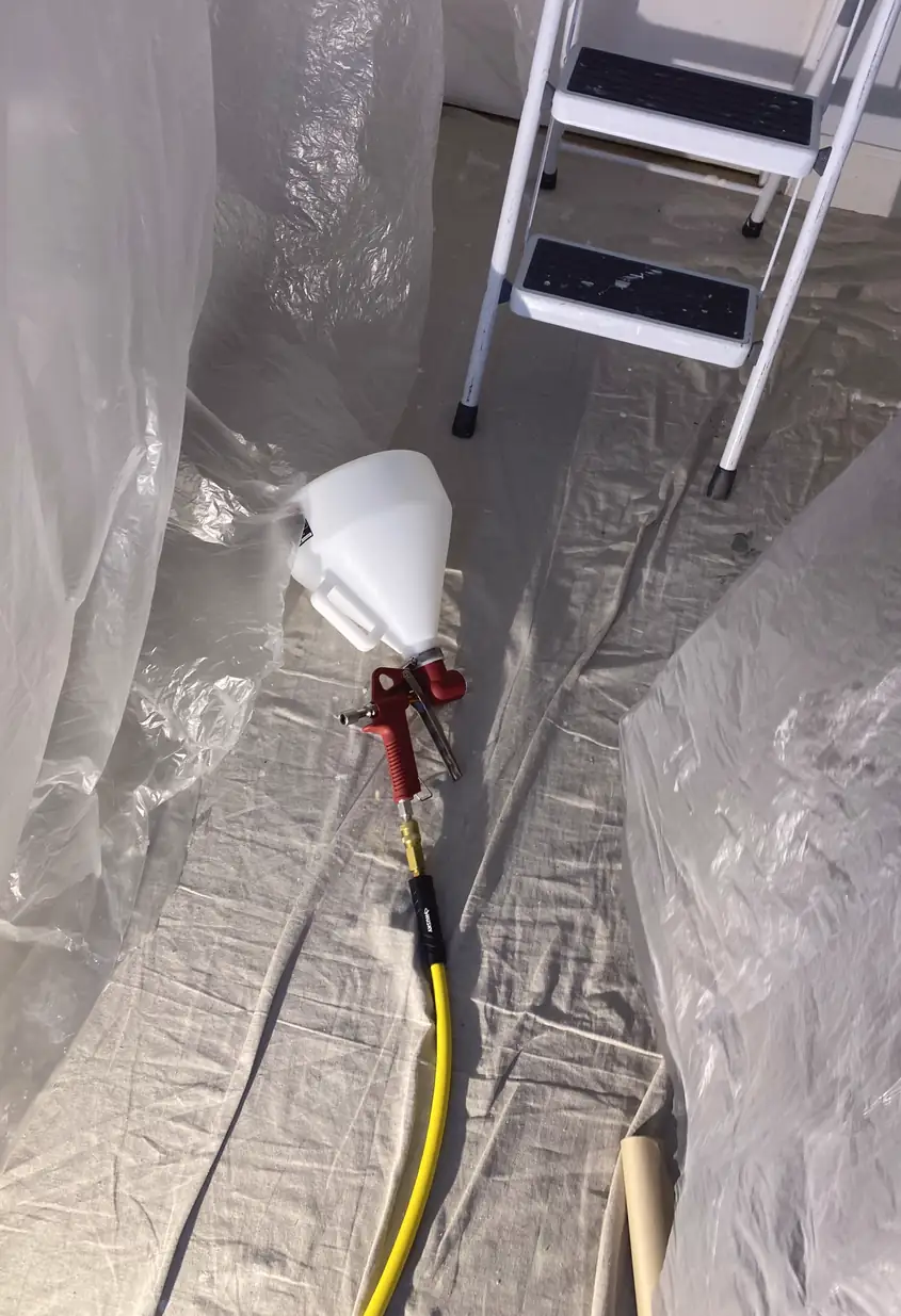 Repaired drywall where a large hole was patched and skimmed to a smooth, flat surface with no visible seams or shadows.