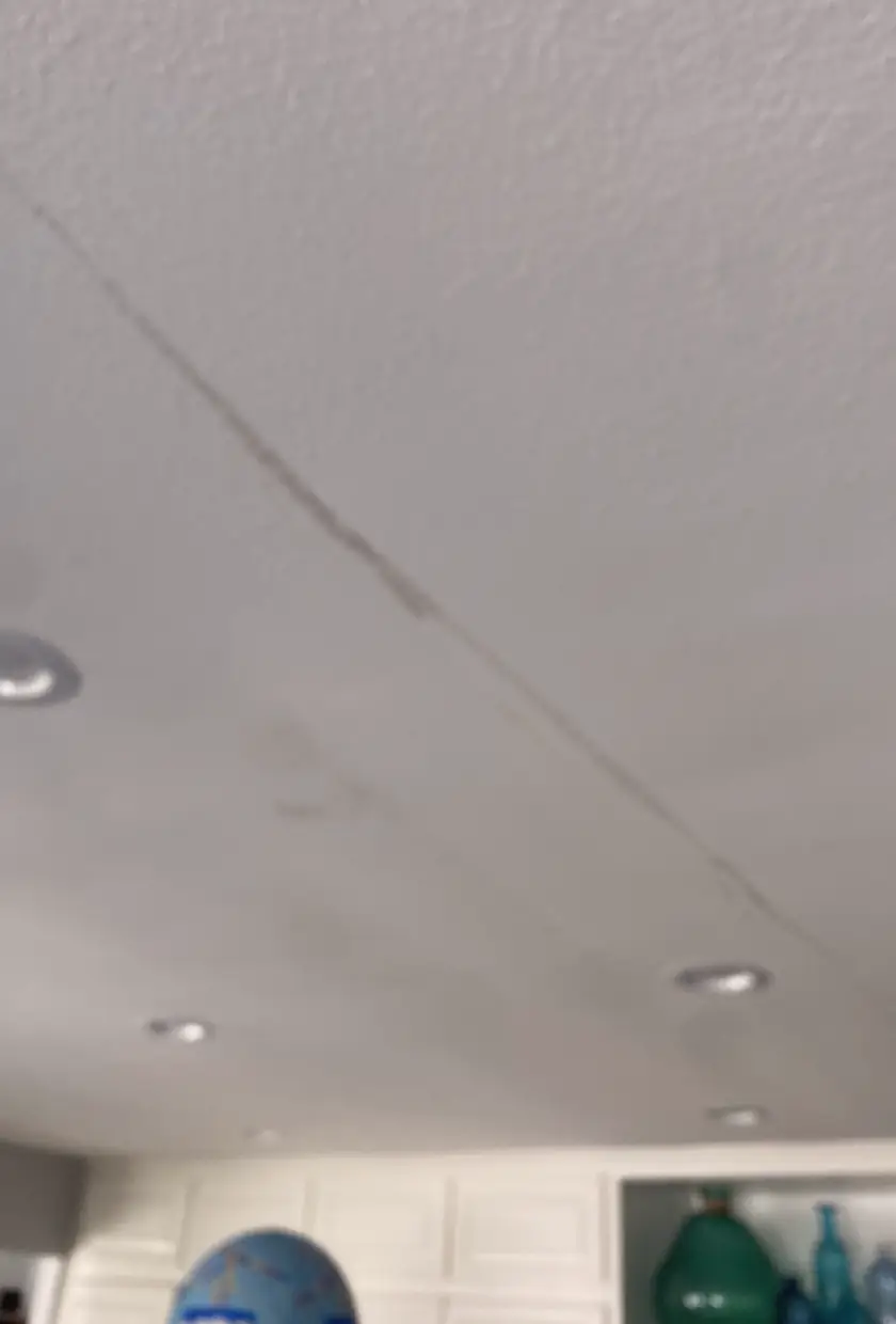 Repaired drywall patch where hole was, now a smooth and even wall surface with no visible seams or shadows in Cypress.