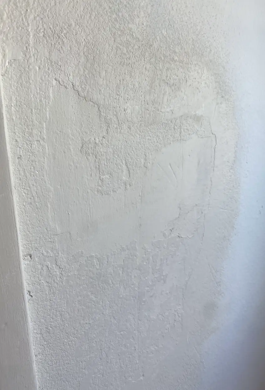 Drywall patch in Cypress with a rebuilt hole, surface skimmed and blended to a smooth, even finish without visible seams or shadows.