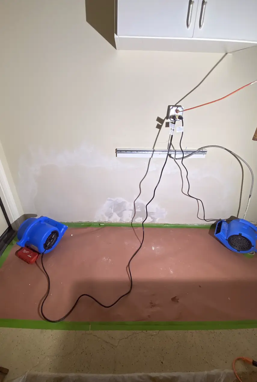 Repaired drywall hole in Dana Point home, surface skimmed and blended with surrounding wall, smooth and even with natural light.