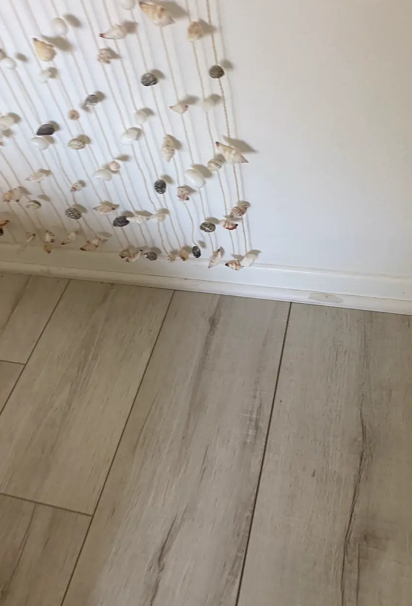 Repaired large drywall hole in Dana Point home, surface smoothly patched and lightly blended with no visible seams or shadows.