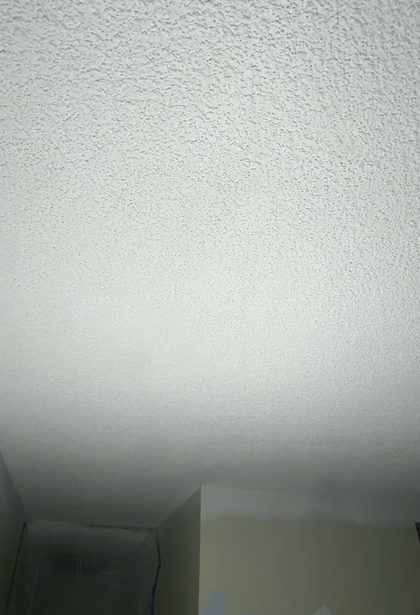 Repaired drywall patch in Dana Point showing a smooth, flat wall with no visible seams or shadows after fixing a medium hole.