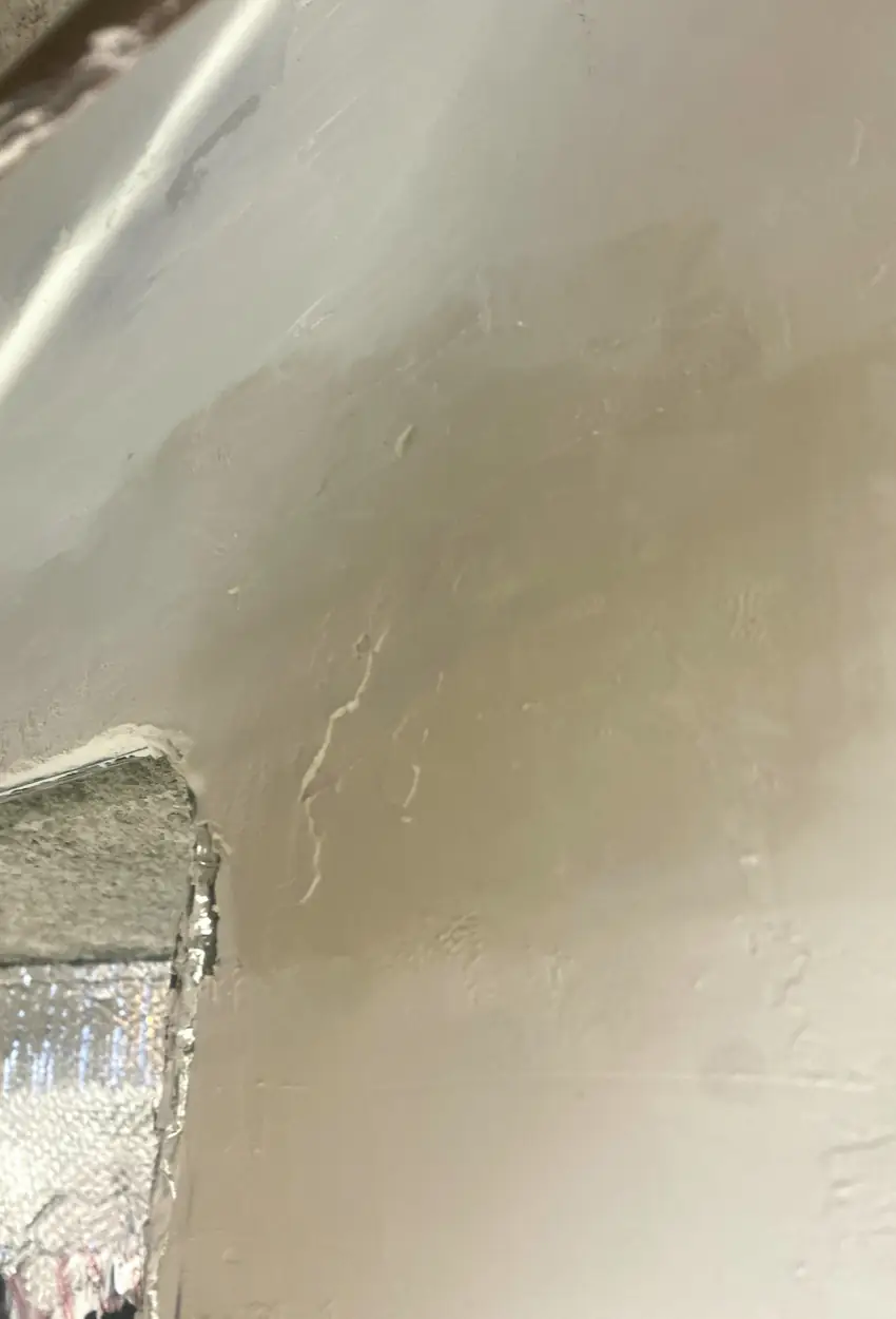 Hole patched and skimmed over in drywall repair, wall surface smooth and even, no visible seams or shadows in Dana Point home.