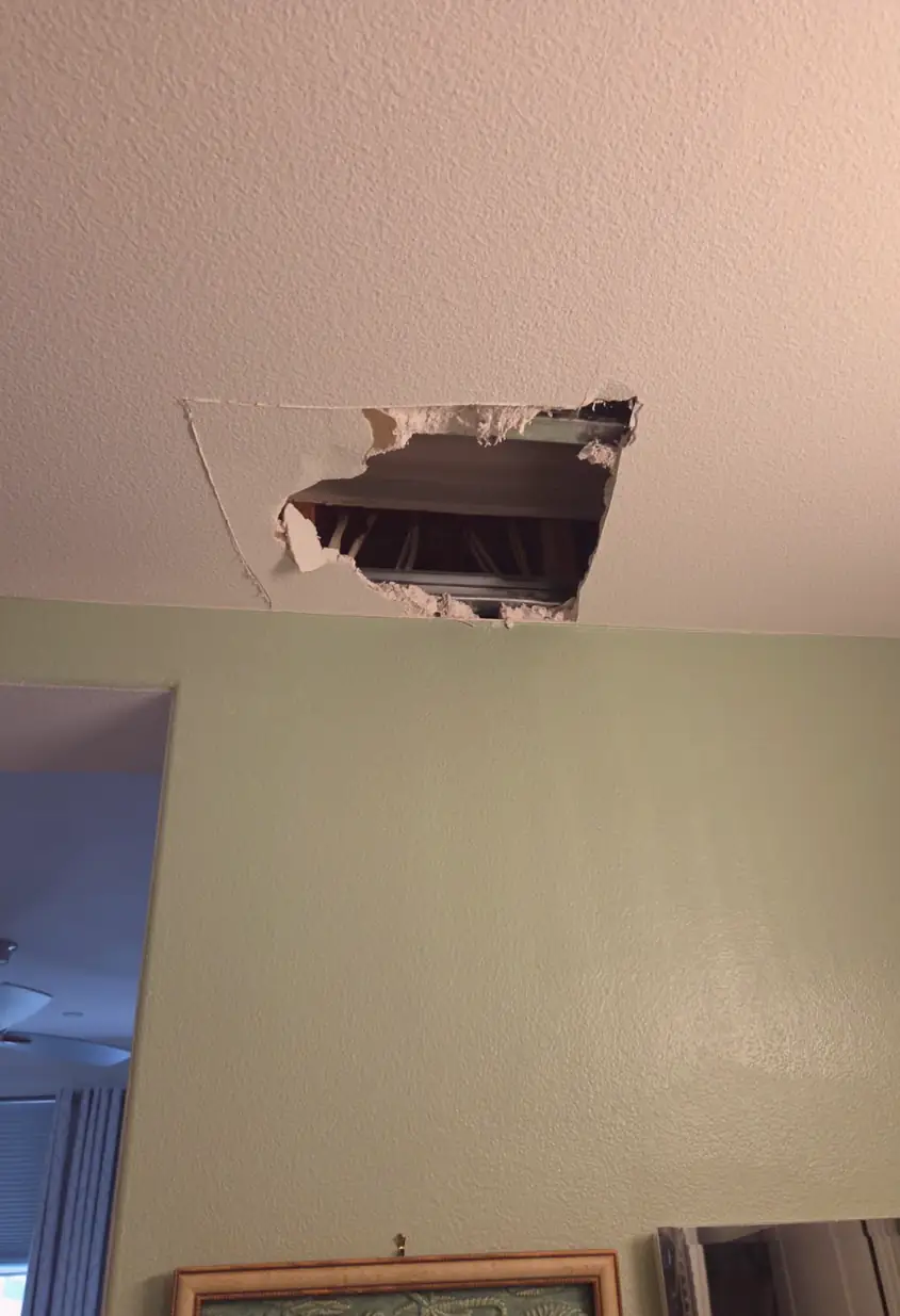 Repaired drywall patch in Dana Point shows smooth, even surface with no visible seams or shadows after fixing a large hole.