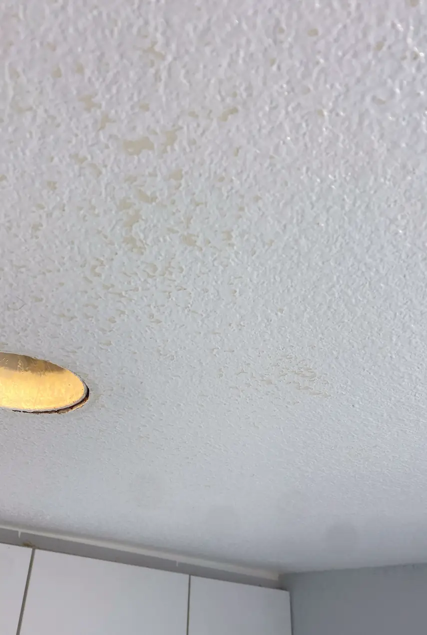 Seamless wall with a smooth finish after patching a large drywall hole, no visible seams or shadows in Huntington Beach.