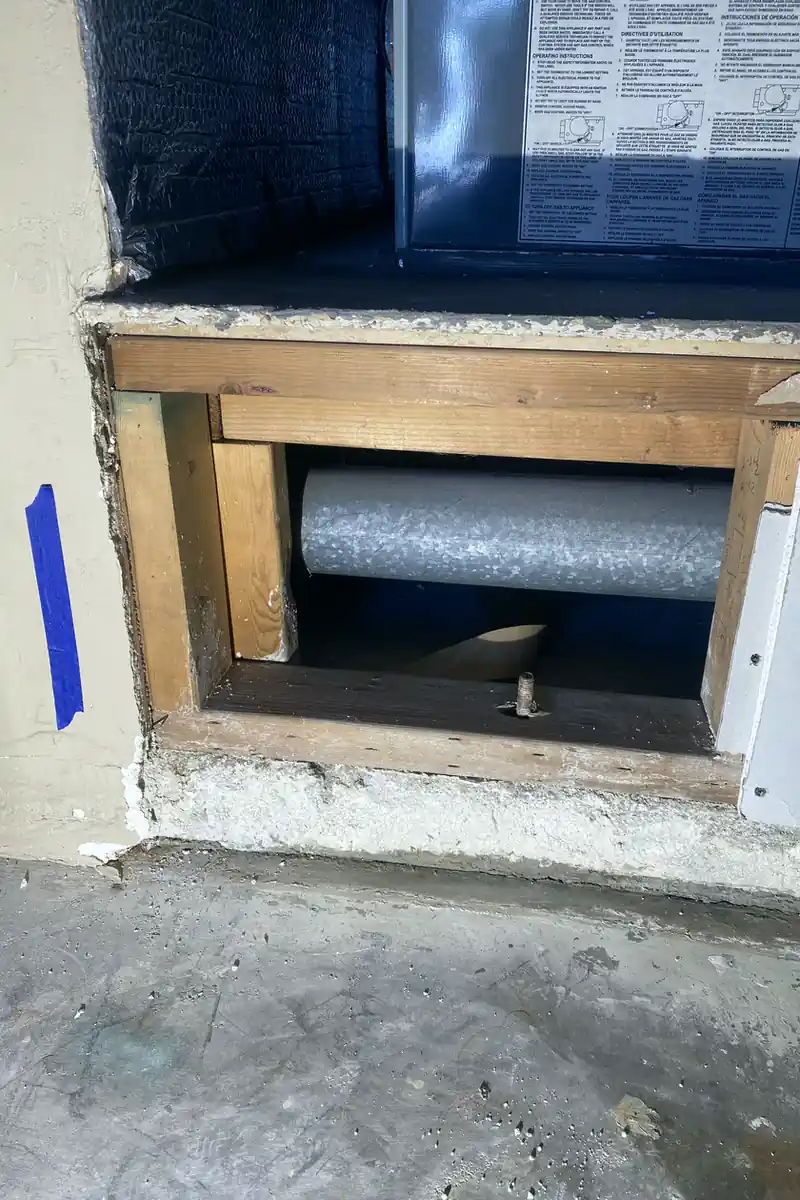 Repaired drywall hole now smoothed and blended seamlessly into the wall with no visible seams or shadows.