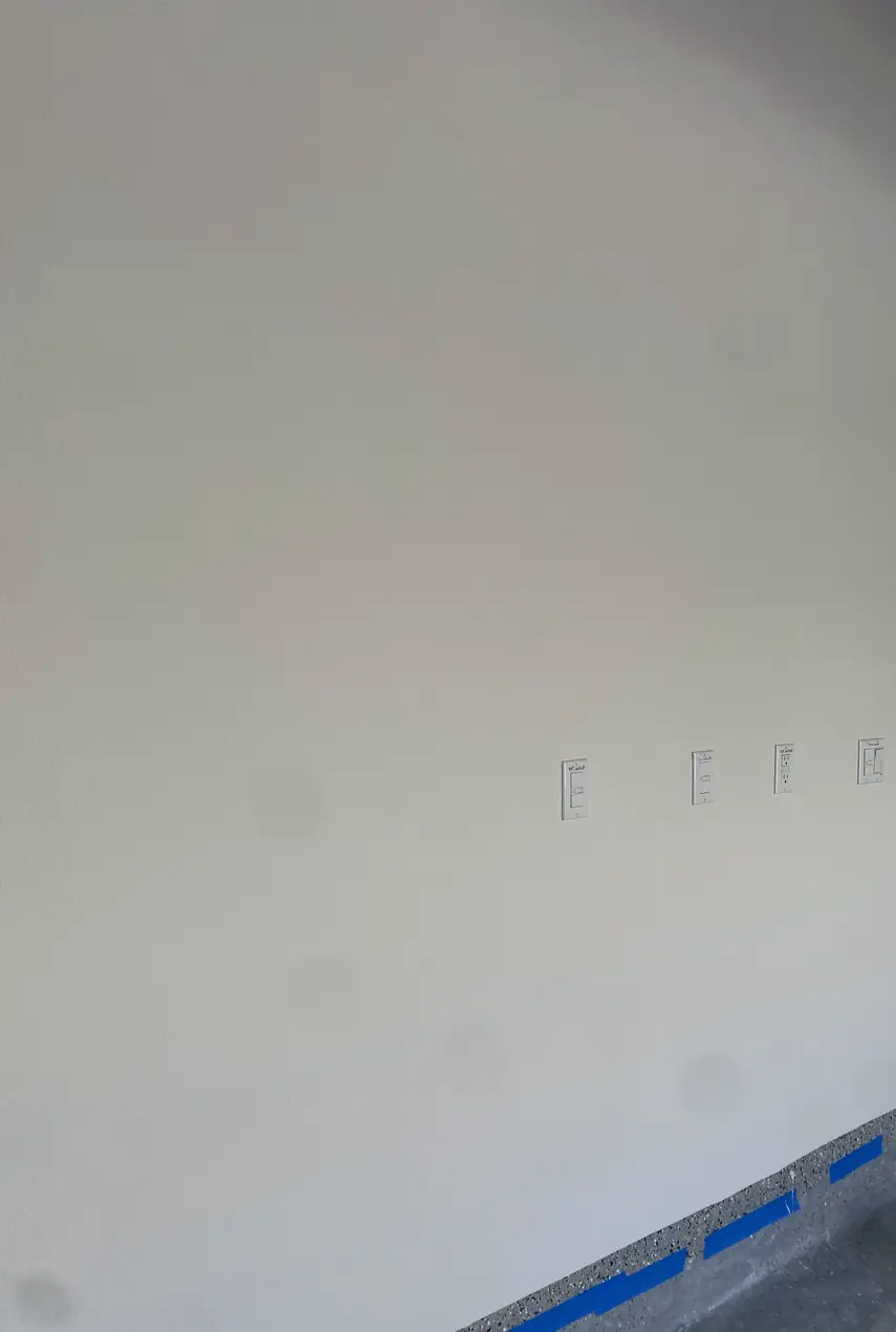 Patched drywall hole in Huntington Beach home now blended and smooth, with an even surface showing no visible seams or cracks.