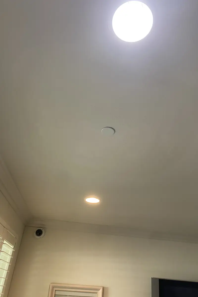 Repaired drywall hole seamlessly patched and blended to match the surrounding wall with a smooth, even finish and no visible seams.