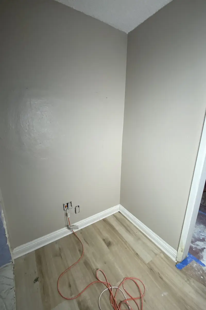Patched drywall hole now blends smoothly with surrounding wall, no visible seams or shadows in Huntington Beach repair.