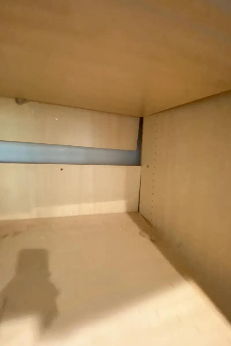 Repaired drywall where a large hole was patched and skimmed to a smooth, even surface with no visible seams or shadows.