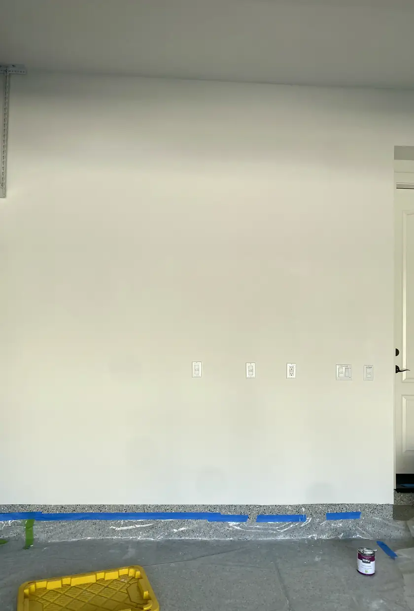 Hole in drywall patched and blended into smooth wall with no visible seams, natural light shows even surface in Irvine home.