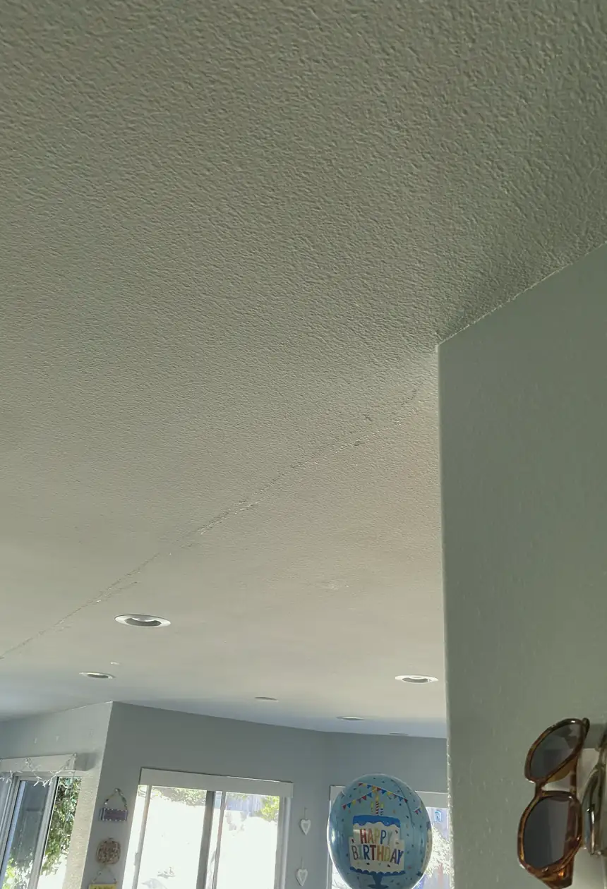 Repaired drywall patch in Irvine showing a once damaged wall now flat and blended with smooth, even surface and no visible seams.