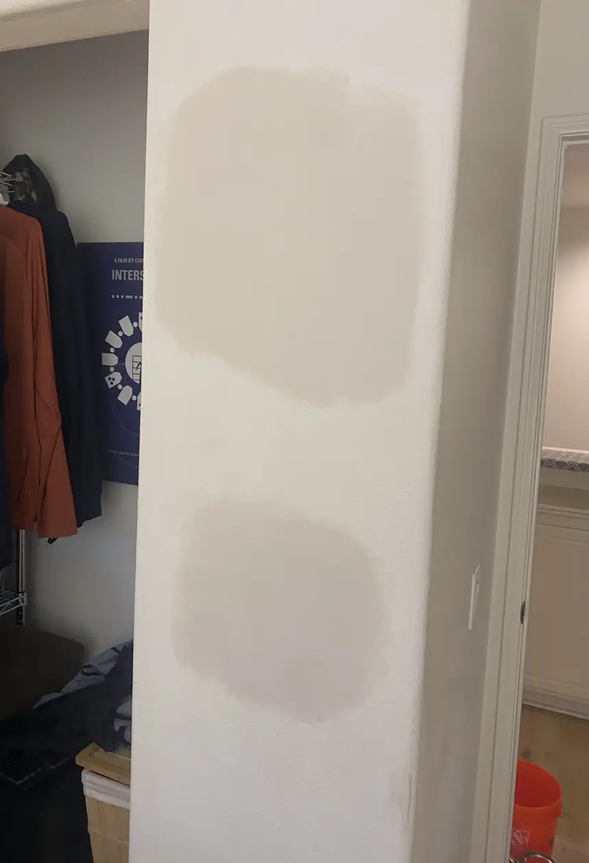 Patched wall with a previously rough crack now rebuilt to a smooth, flat surface with no visible seams under natural light.