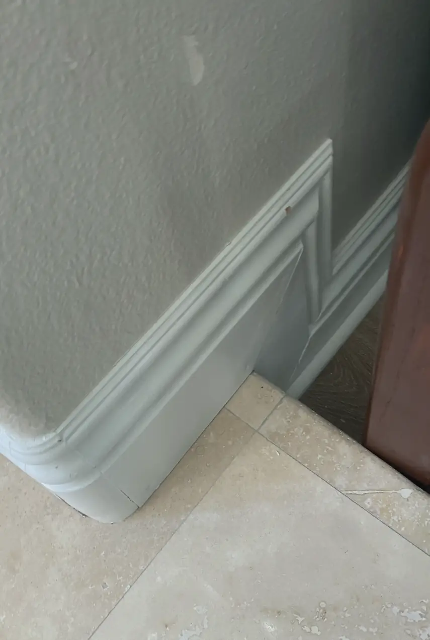 Repaired drywall where a large hole was patched and skimmed smooth, blending seamlessly into the surrounding flat wall.