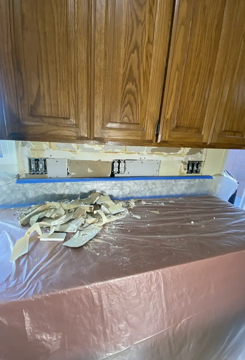 Patched hole in drywall now smooth and flat with paint perfectly matched, no visible seams or shadows on the wall in Los Alamitos.