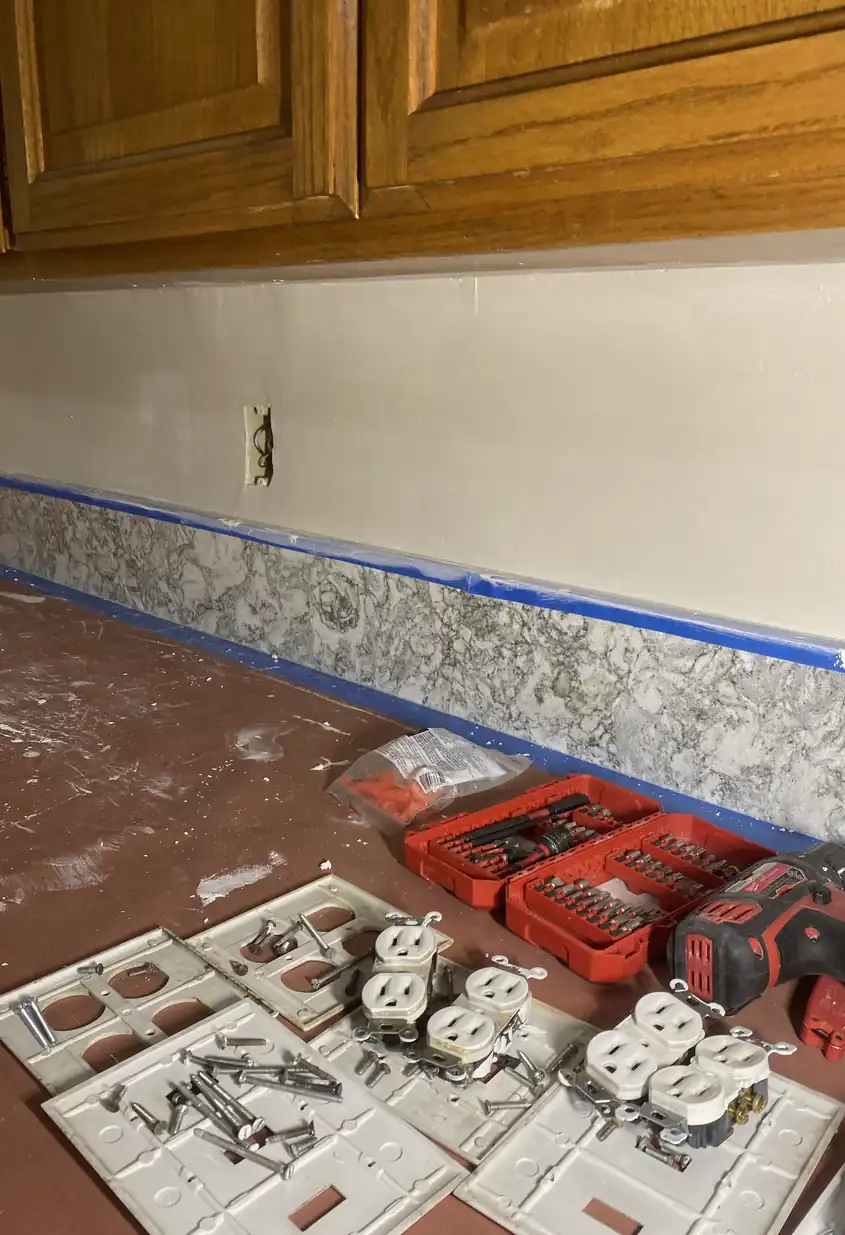 Repaired drywall hole now smooth and flat with no visible seams, surface evenly lit and blended with surrounding wall.