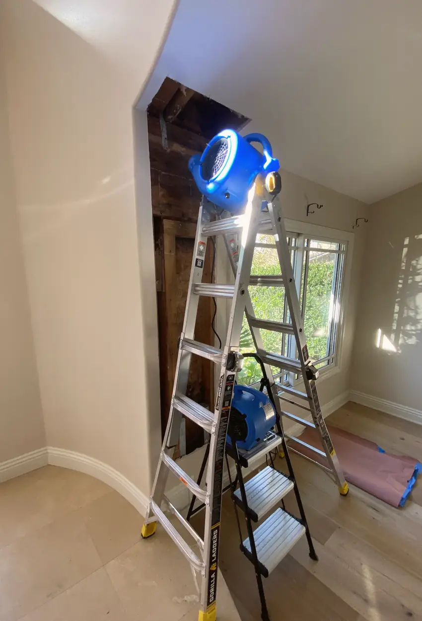 Repaired hole in sheetrock with a smooth, flat surface that blends flawlessly with surrounding wall under natural light.