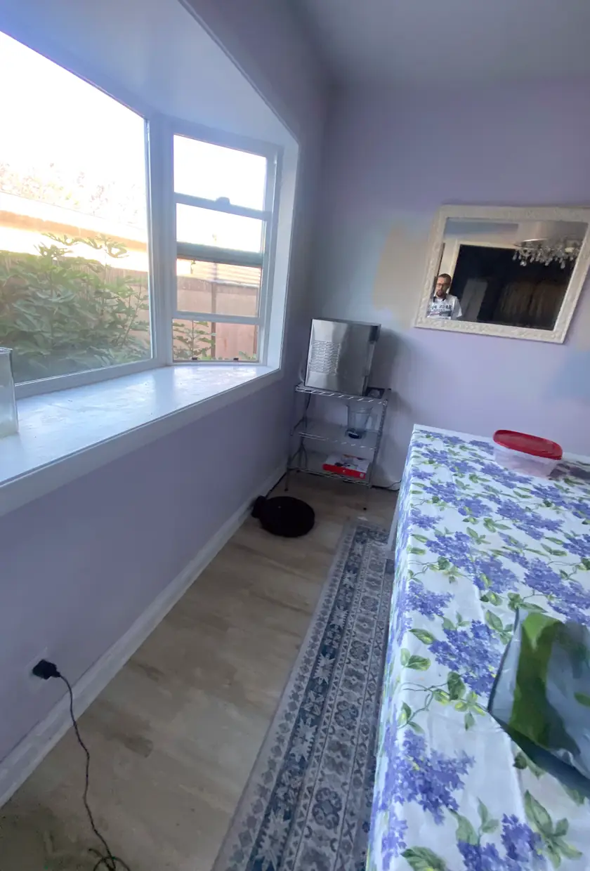 A large hole in drywall patched and skimmed to a smooth, flat finish with no visible seams or shadows.