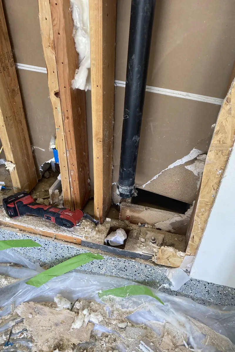 Repaired drywall hole in Stanton home, surface patched and skimmed smooth, blending perfectly with surrounding wall without shadows.