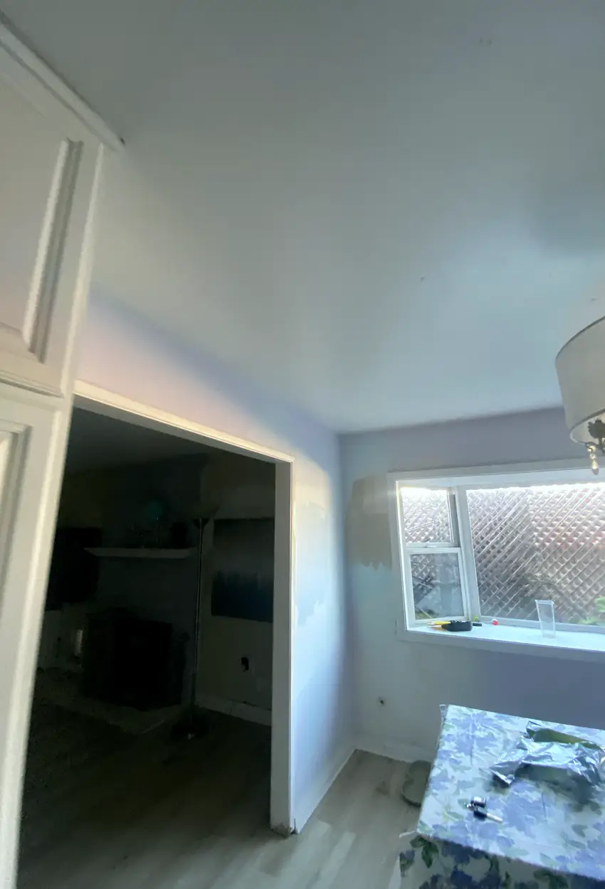 Drywall hole fully patched and skimmed in Tustin with a smooth, seamless surface and even natural light reflection.