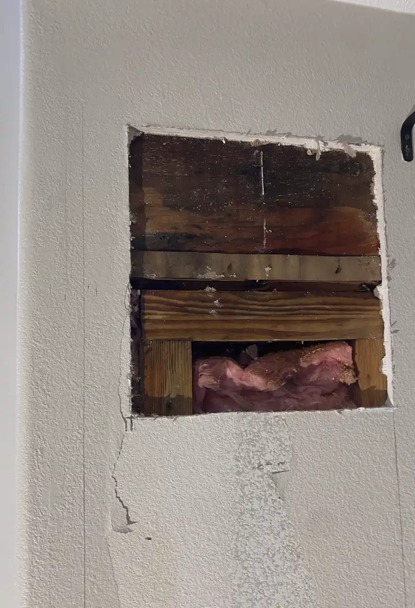 Large hole in drywall patched and skimmed in Villa Park, now a smooth, flat wall with consistent light and no visible seams.