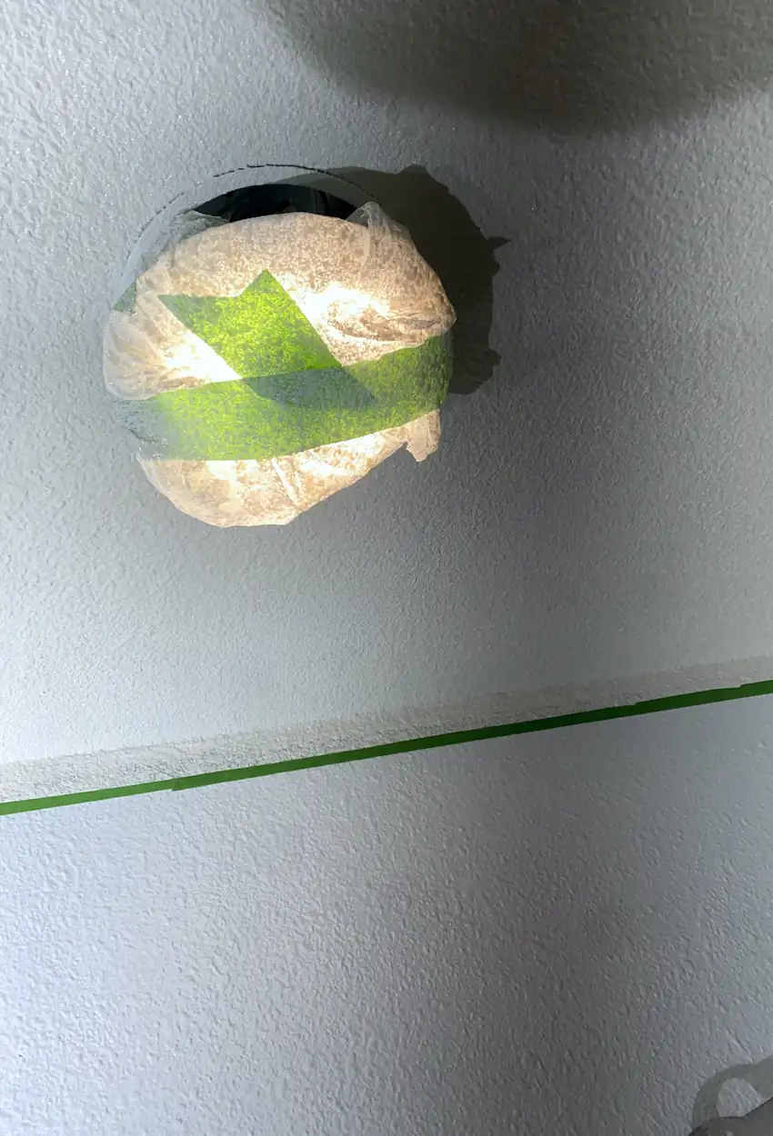 Seamless drywall patch in Westminster where a large hole was rebuilt and skimmed smooth with no visible seams or shadows.