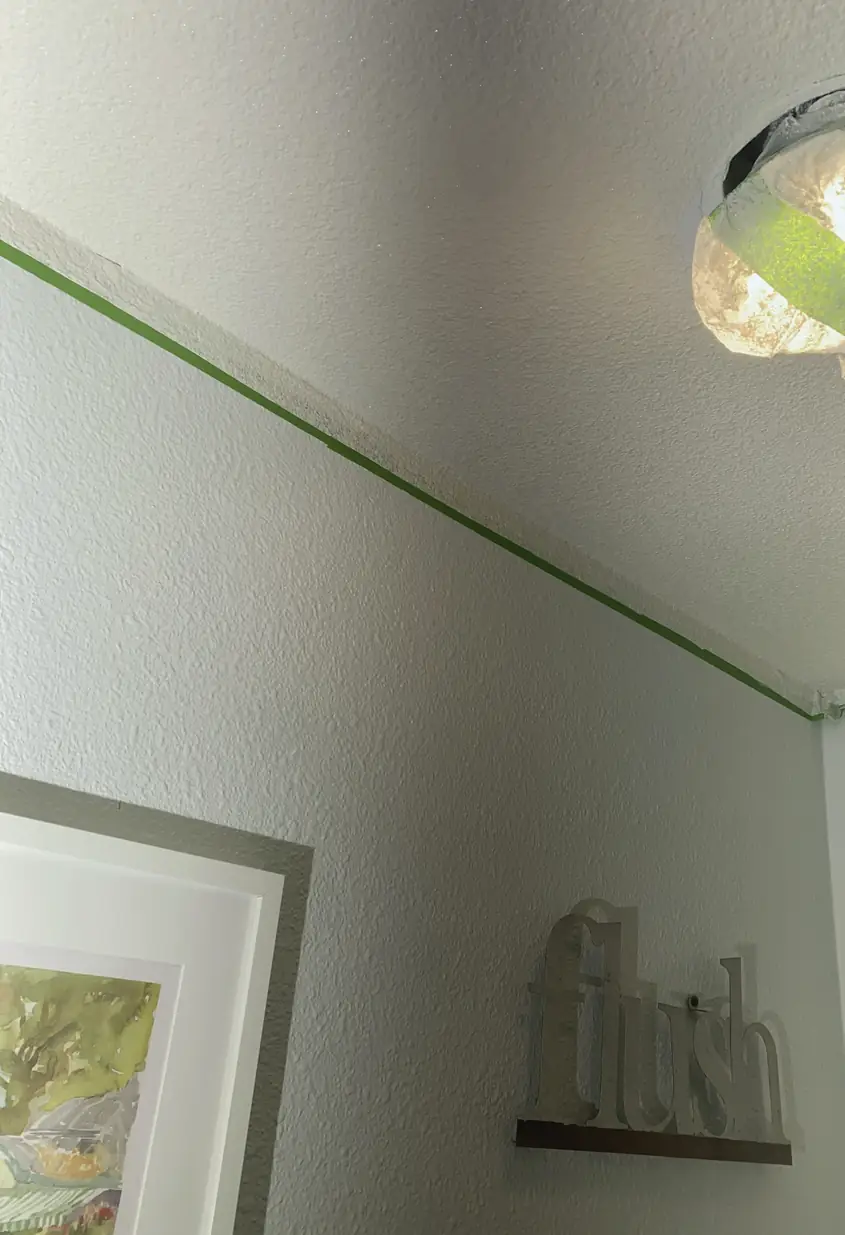 Hole in drywall patched and skimmed to a smooth, flat surface with no visible seams or shadows.